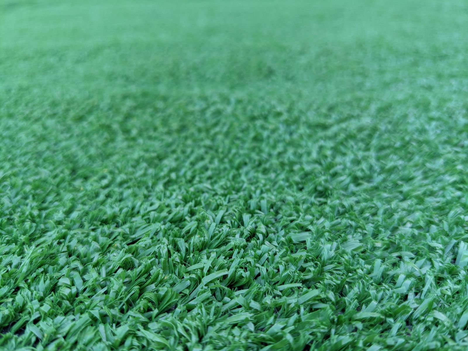 rectangular patch of fake grass for photo or other setup