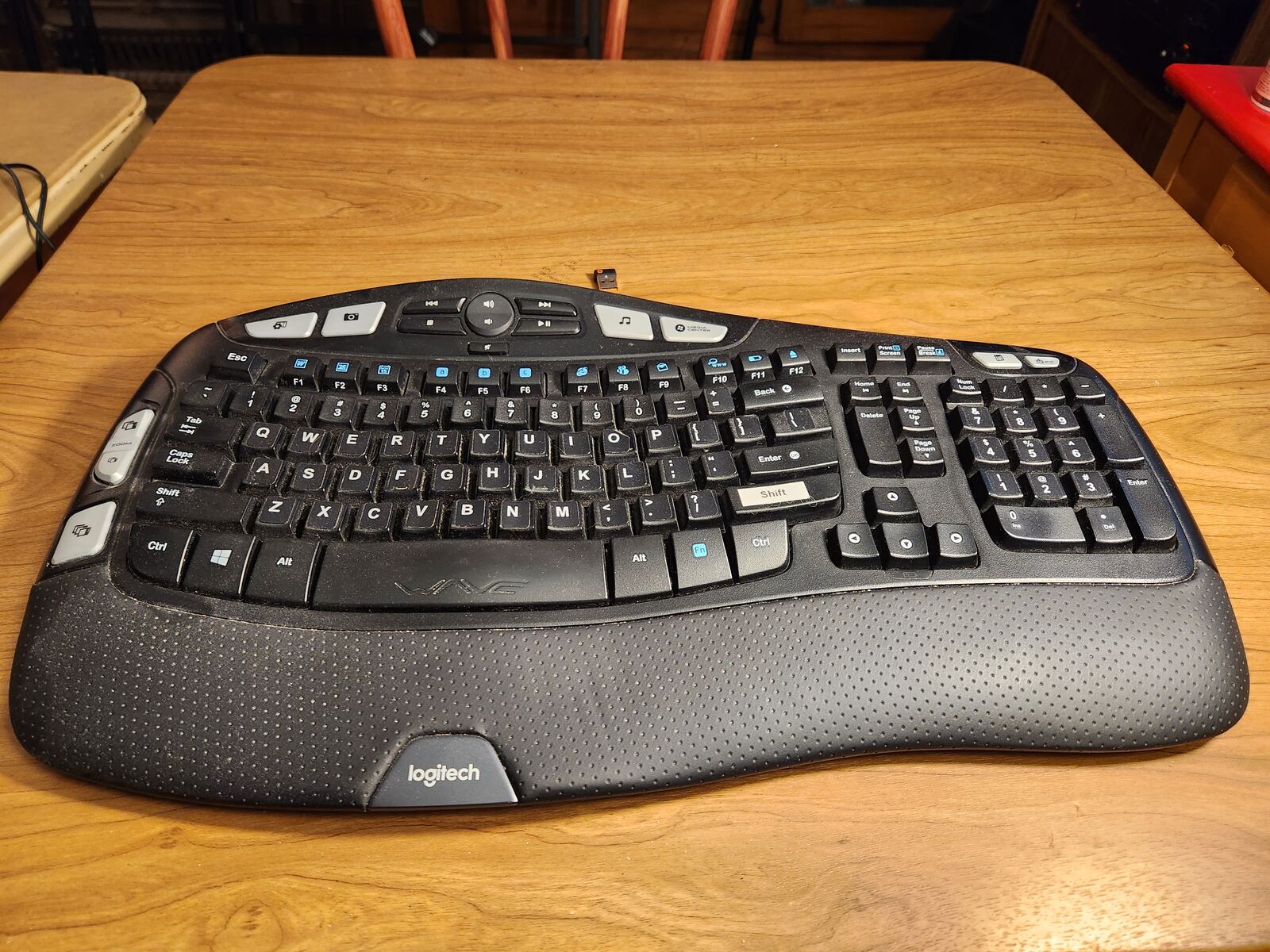 Wireless Logitech WAVE computer keyboard with transmitter. Plugs into USB port.
