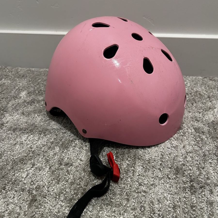 Pink child’s bike helmet
