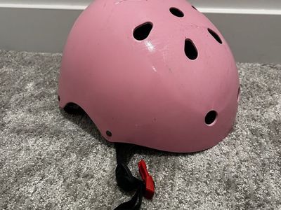 Pink child’s bike helmet