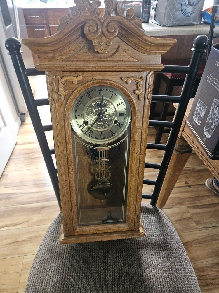 Vintage Wooden Pendulum Wall Clock with Brass Dial and Carved Details