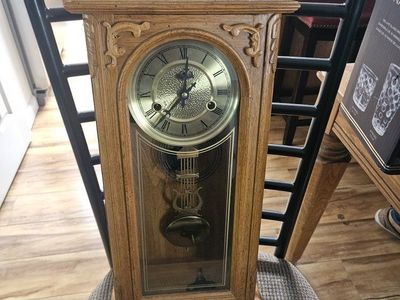 Vintage Wooden Pendulum Wall Clock with Brass Dial and Carved Details