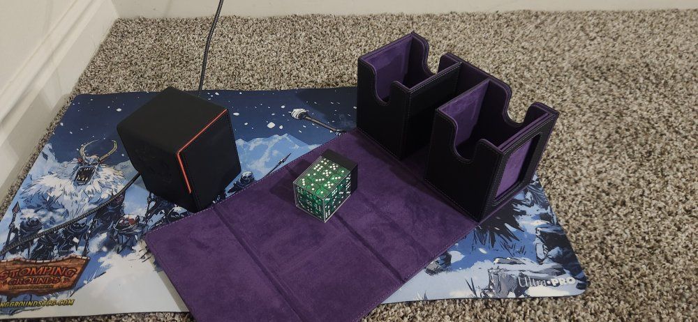 magic the gathering deck box , playmat, and dice