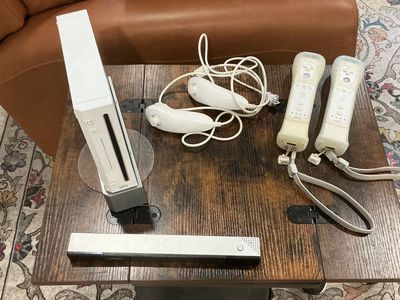 Wii Console Bundle with 6 Games, 2 Controllers, Nunchucks, and Accessories including Balance Board (not shown)