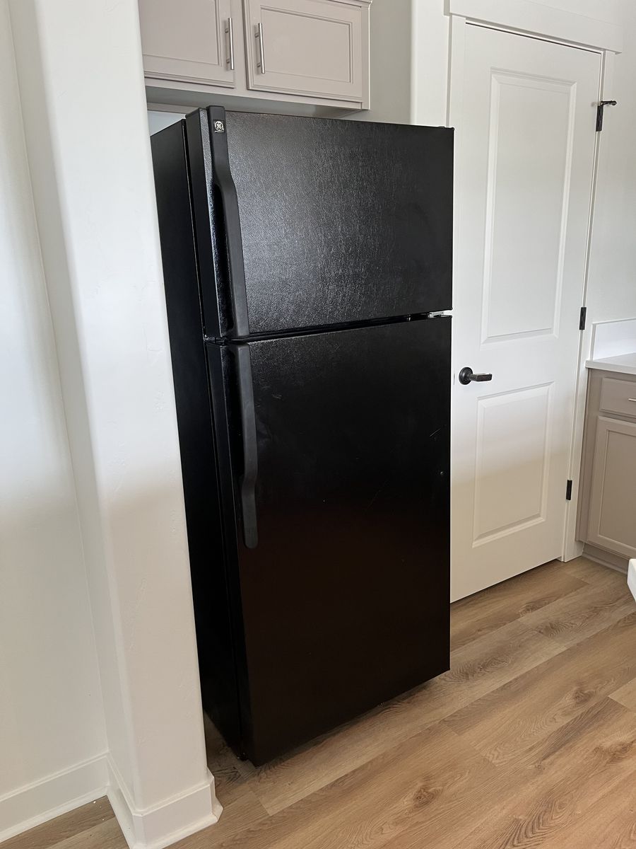 GE refrigerator (top freezer) with ice maker, black