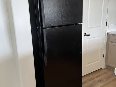 GE refrigerator (top freezer) with ice maker, black