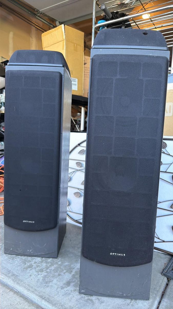 Pair of Optimus Pro LX-10 floor-standing speakers in good working condition.
