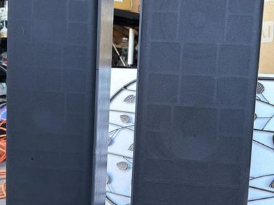 Pair of Optimus Pro LX-10 floor-standing speakers in good working condition.