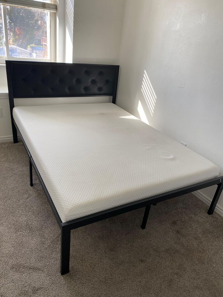 metal bed with headboard and mattress
