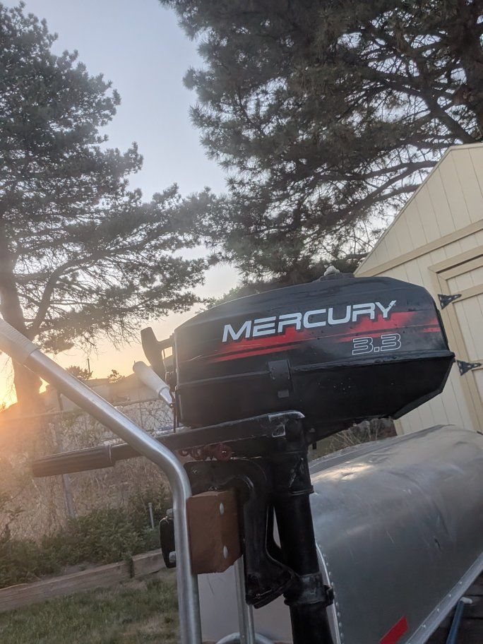 Grumman 15' Aluminum Canoe w/ Mercury 3.3 Outboard Motor, Oars, Dolly, & Stabilizers