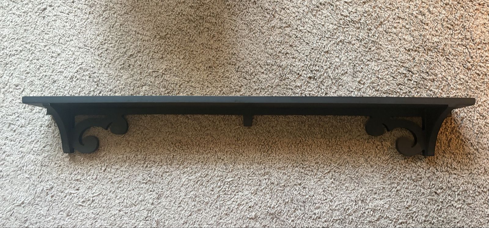 Black Wooden Wall Shelf with Decorative Scroll Brackets