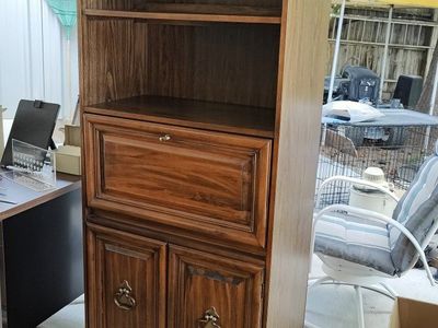 Wooden bookshelf with fold out writing surface. 30" wide x 73" tall x 16" deep.