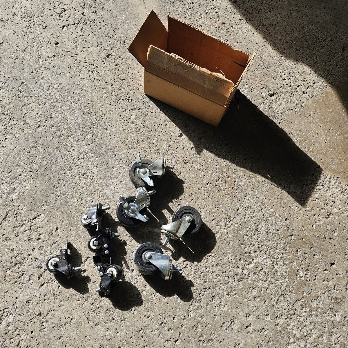 Box of casters. Never used.