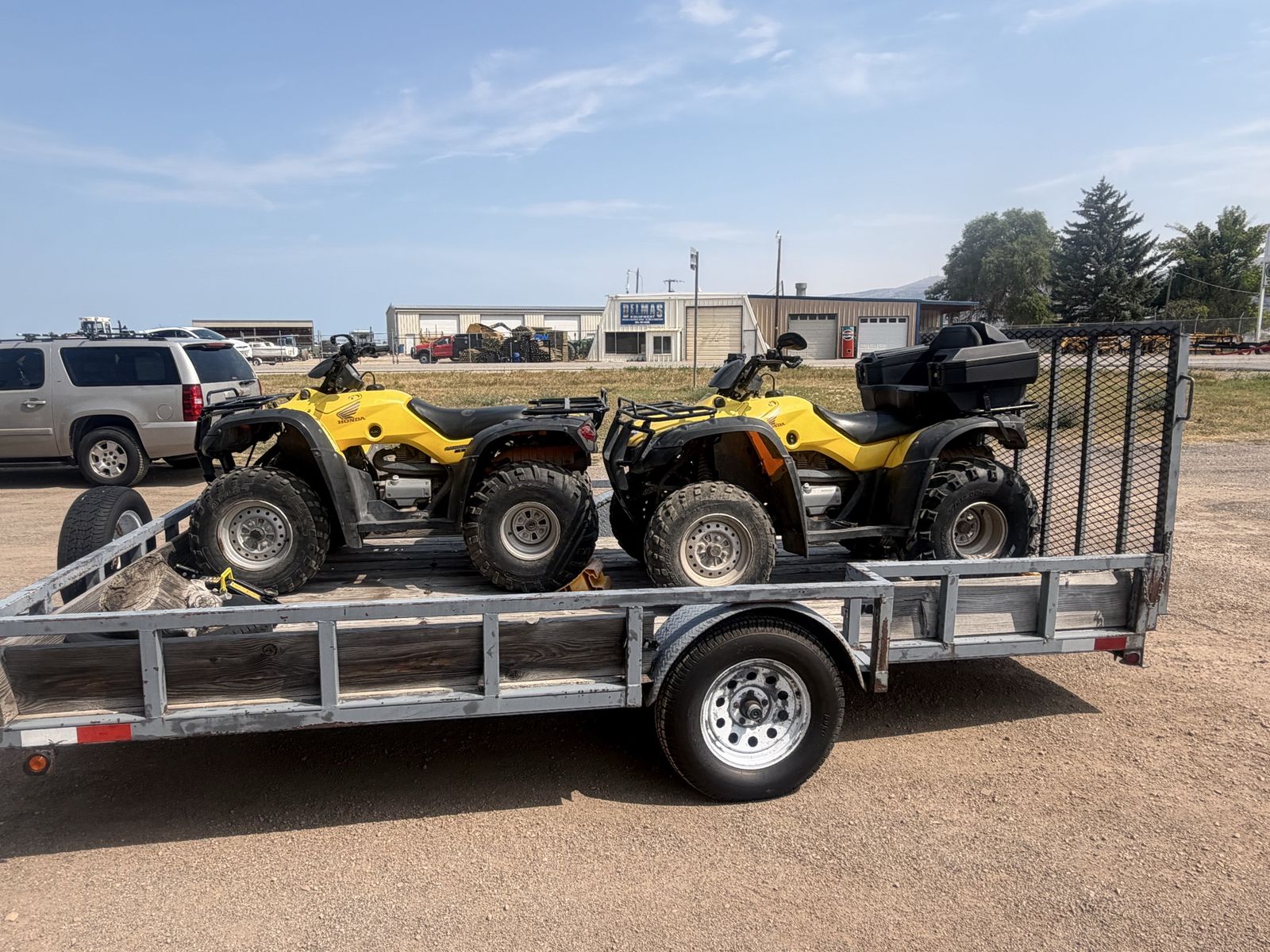 Yellow Honda ES 350 Ranchers ATVs & Trailer