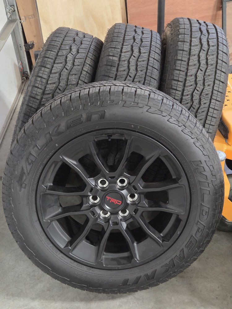 Set of 4 Falken Wildpeak A/T3W 265/60R20 Tires on Black TRD Wheels