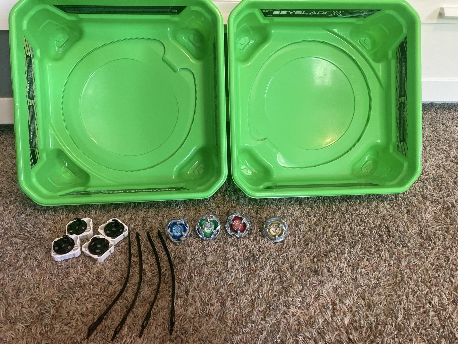 4 Beyblades, 2 arenas, & 3 Launchers - Used
