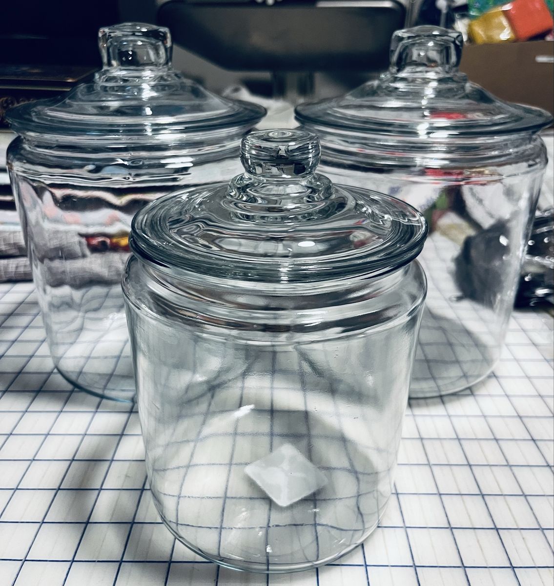 3 matching glass display jars  with lids