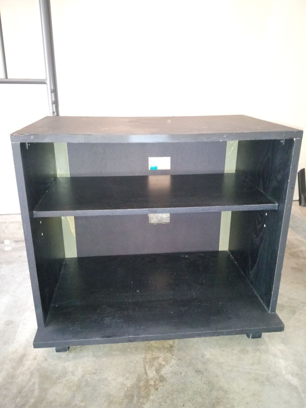 Rolling shelf TV stand or stereo 2 feet wide 21 inches high 14 and a half inches deep