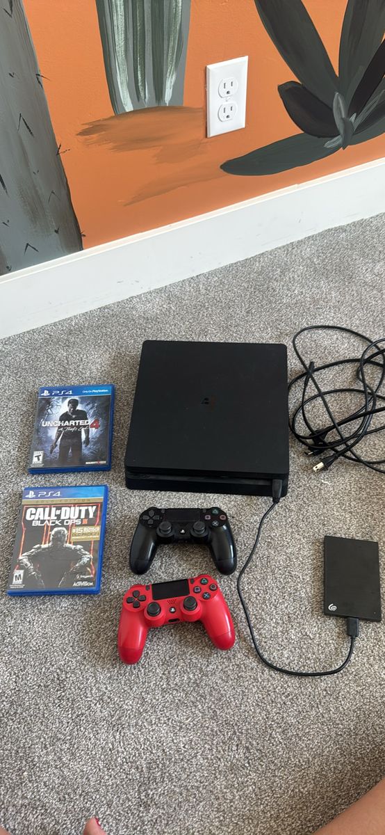 PS4 Slim Bundle – Console + 2 Controllers + Games + External Hard Drive