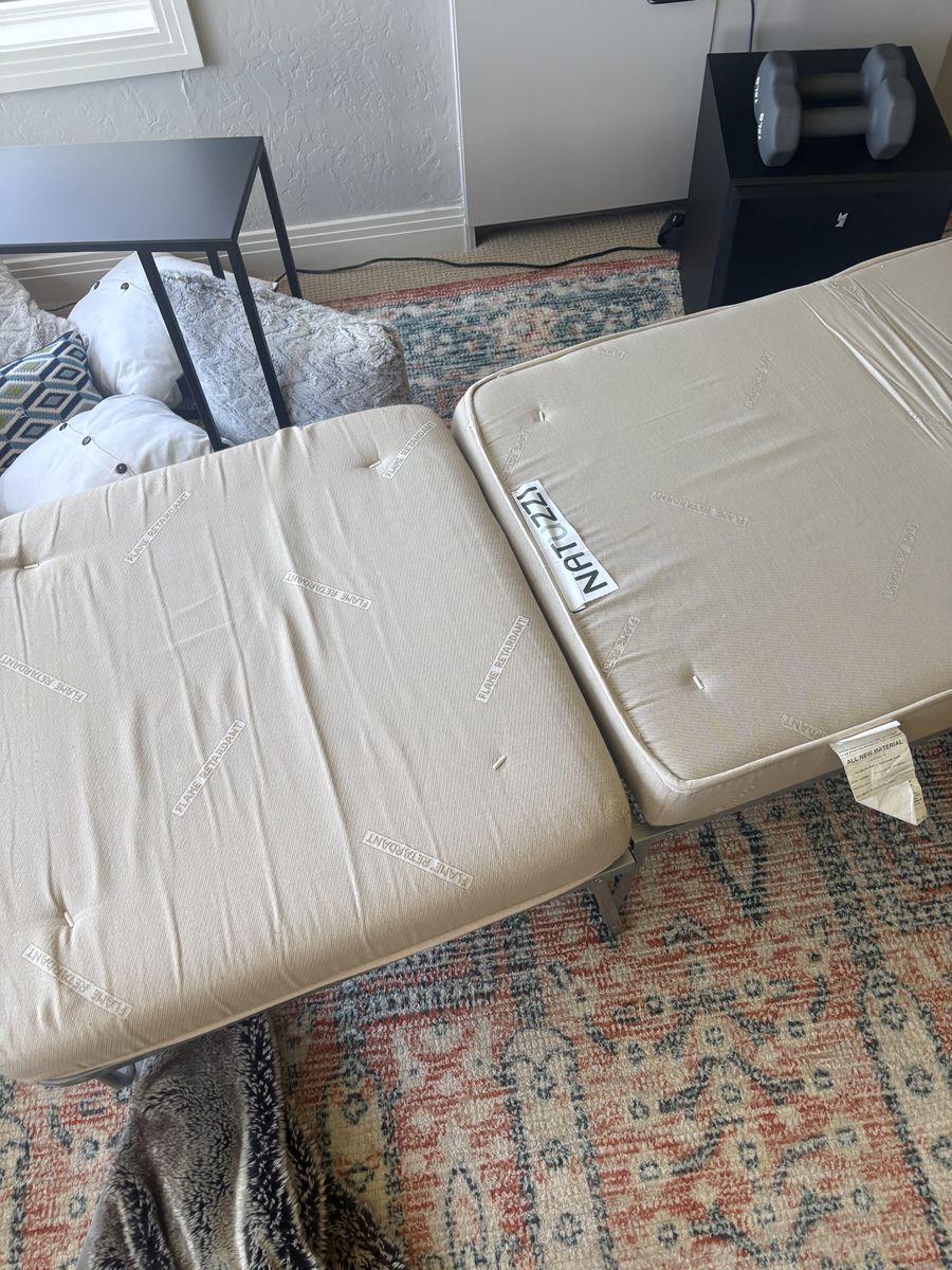 Red fold out twin bed/ottoman