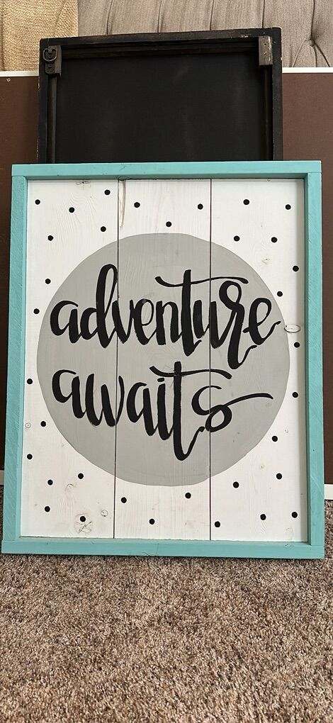 Adventure Awaites sign