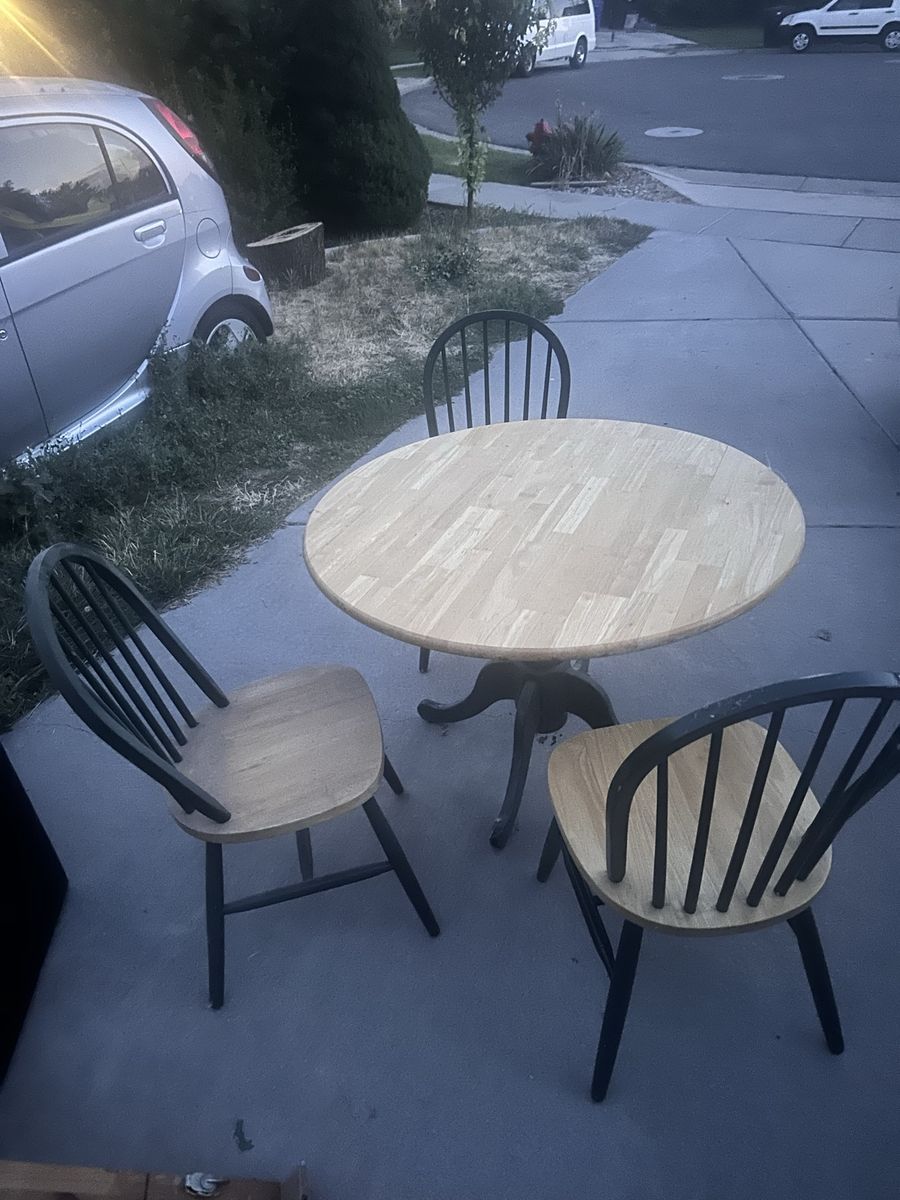 Round Wooden Dining Table with 3 Two-Tone Spindle Back Chairs