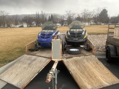 2 Polaris Snowmobiles And A Trailer