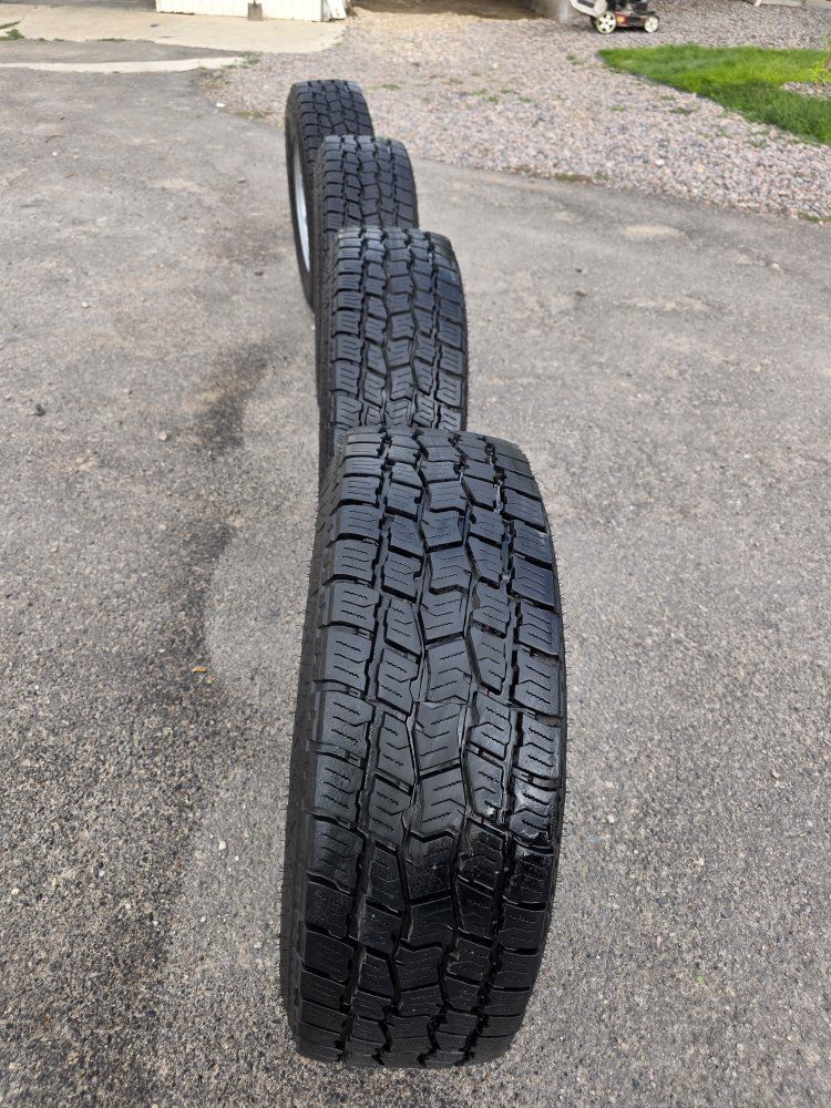Set of 4 Big O Tires LT265/70R17  Mounted on Silver Steel Wheels - Good Tread chevy  8×180 bolt pattern