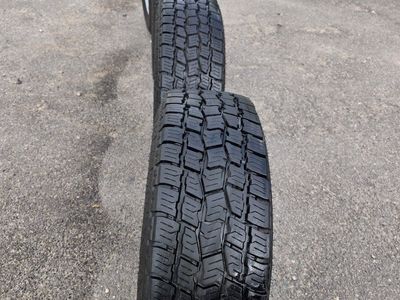 Set of 4 Big O Tires LT265/70R17 Mounted on Silver Steel Wheels - Good Tread chevy 8×180 bolt pattern