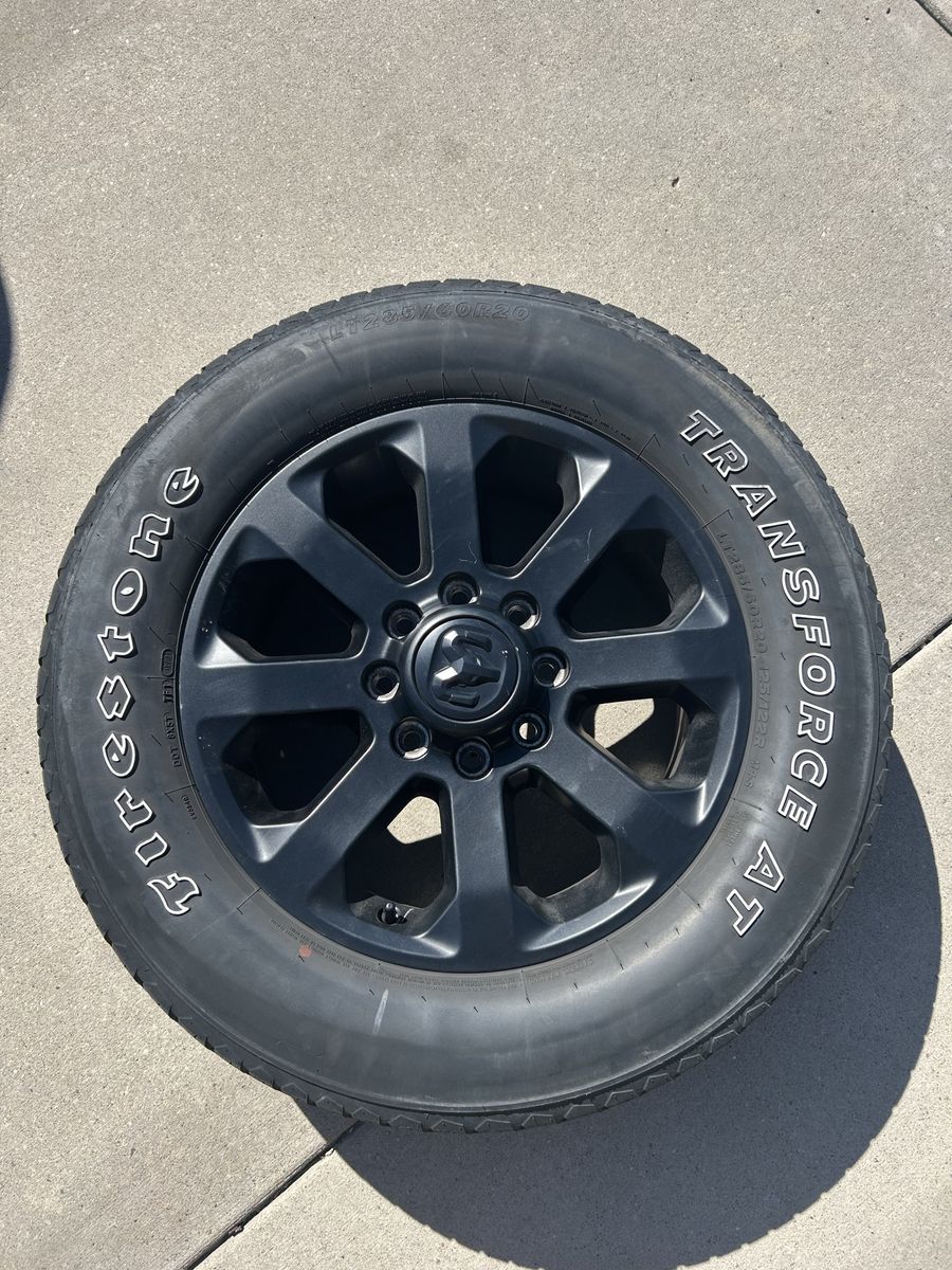 Dodge Ram 20” midnight wheels and tires.
