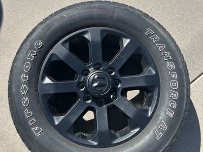 Dodge Ram 20” midnight wheels and tires.