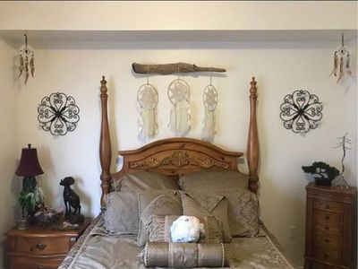Elegant Queen Size Solid Wood Carved Poster Bed & Matching Dresser with Mirror - good condition.