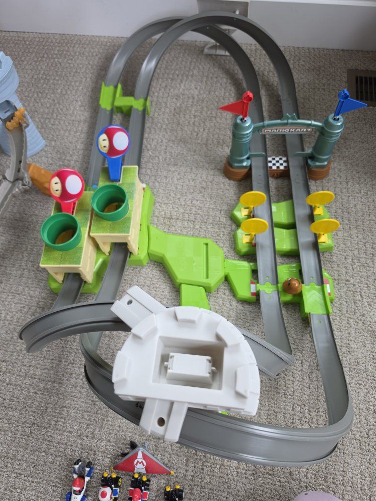 Hot Wheels Mario Kart Circuit Track Set with Mario character karts included.