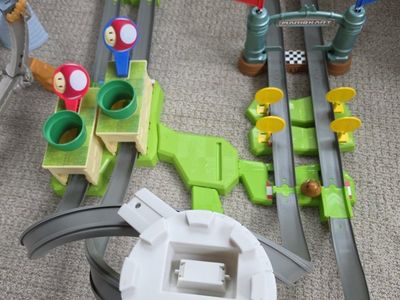 Hot Wheels Mario Kart Circuit Track Set with Mario character karts included.