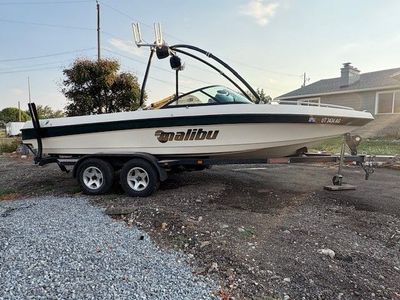 99 Malibu Sunsetter 21’ boat with rear teak swim deck w/Malibu trailer