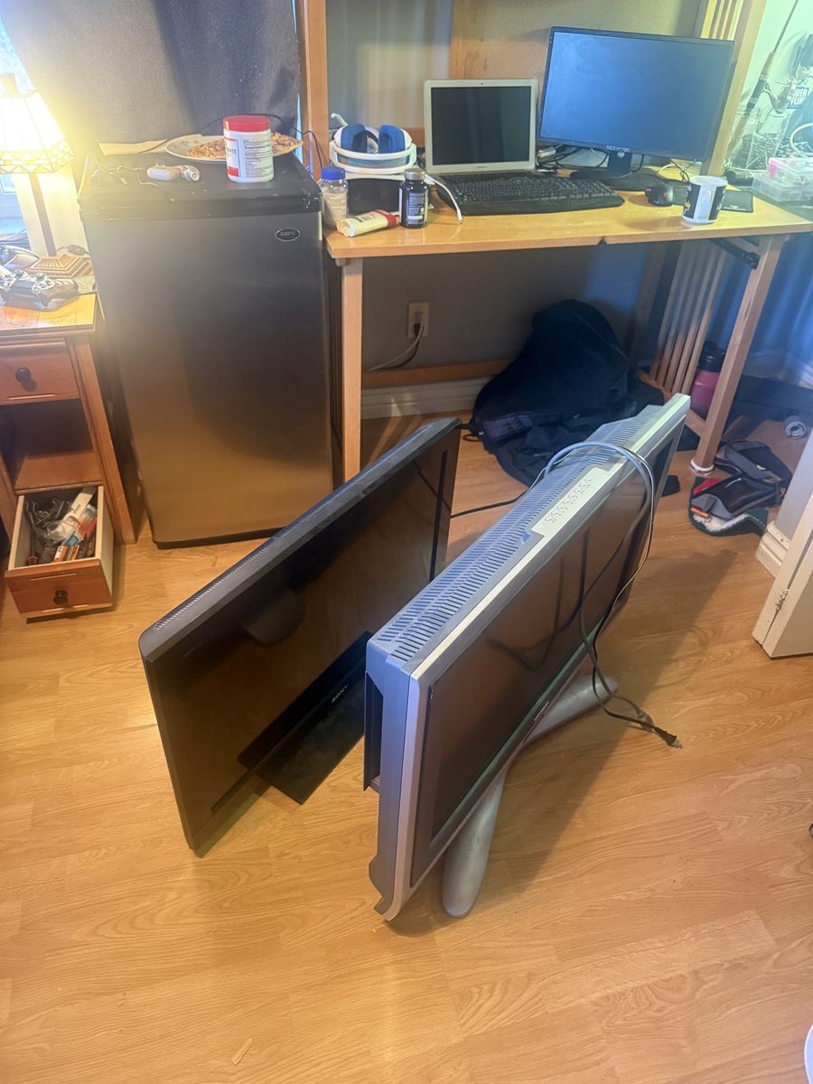 35 inch Sony Bravia and grey tv