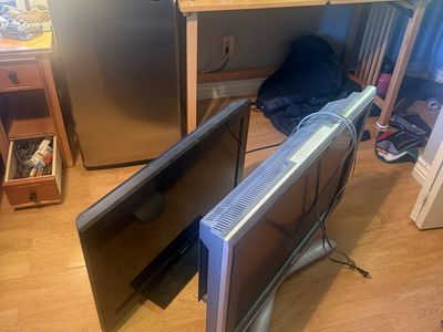 35 inch Sony Bravia and grey tv