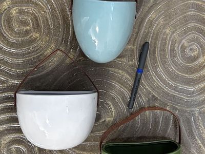 Three ceramic wall pockets