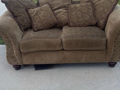 Brown Fabric Loveseat with Patterned Cushions and Nailhead Trim