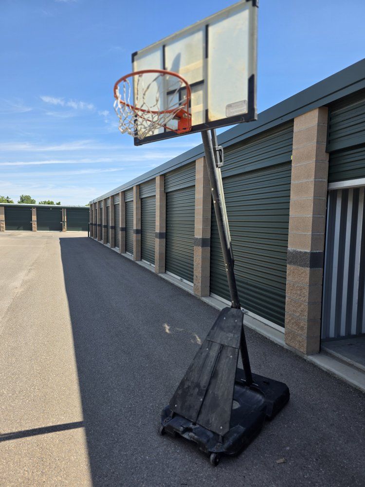Portable Basketball Hoop with Adjustable Height and Base Wheels