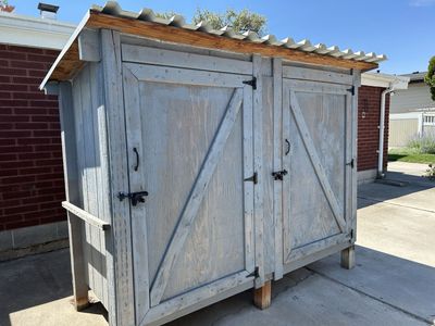 Custom-Built Outdoor Storage Shed - Durable Wood Construction, Corrugated Metal Roof