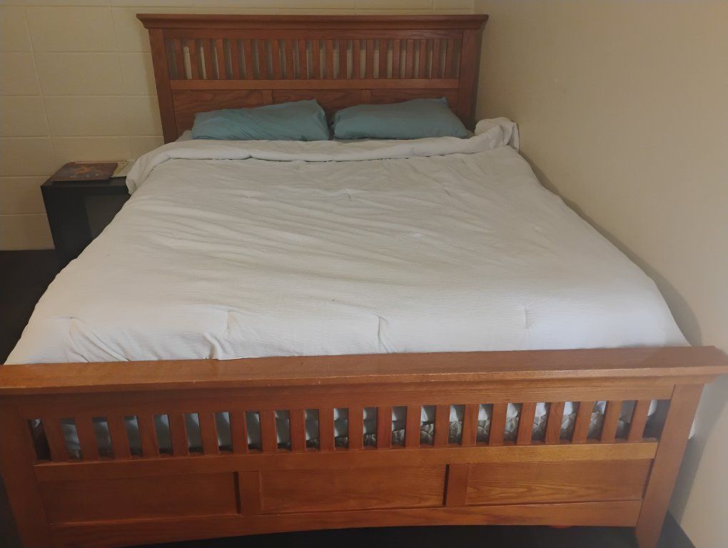 Queen-sized bed and mattress