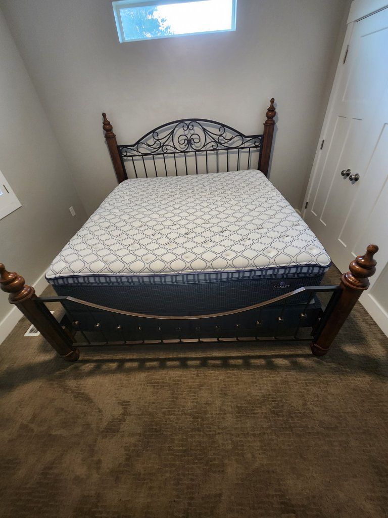 King sized bed and matching head / foot boards and night stands.