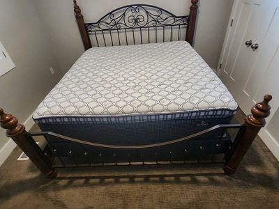 King sized bed and matching head / foot boards and night stands.