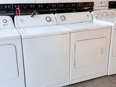 Whirlpool White Top-Load Washing Machine and Electric Dryer Set