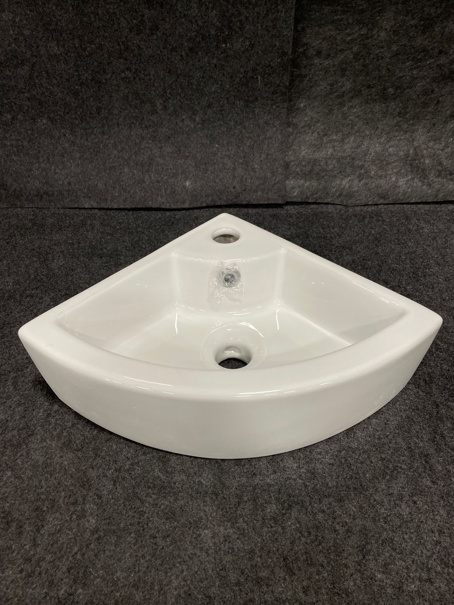 Corner lavatory sink