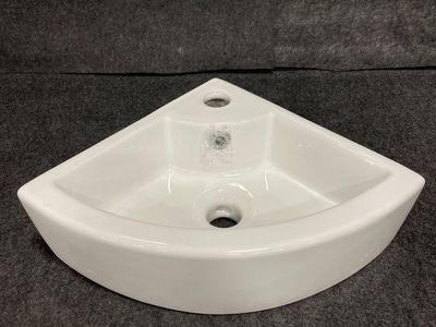 Corner lavatory sink