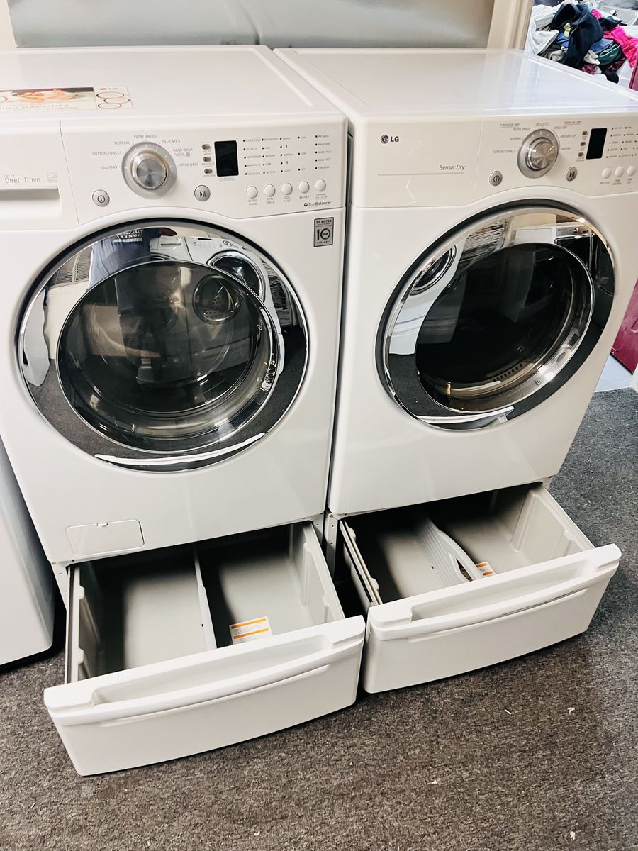LG washer and dryer set with pedestals
