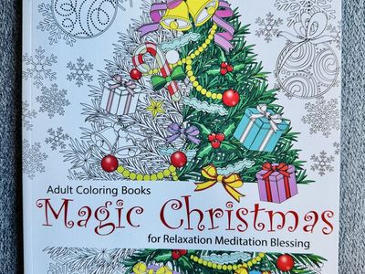 The "Magic Christmas" adult coloring book by Cherina Kohey, featuring 61 pages of holiday-themed designs.