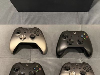 Xbox One X Console with 4 Controllers, Charging Dock, and 7 Games
